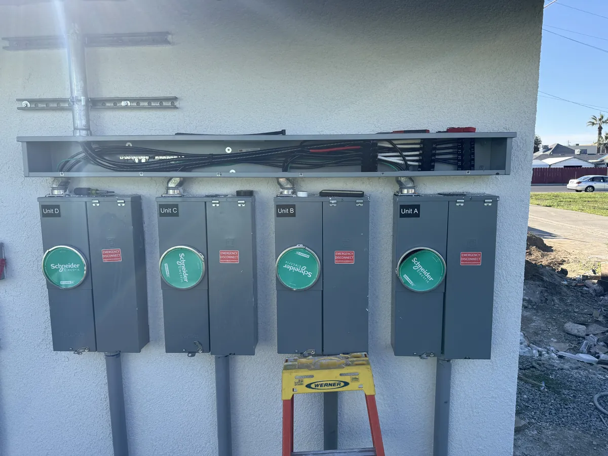 Four unit meter bank with new service conductors at a multi unit property