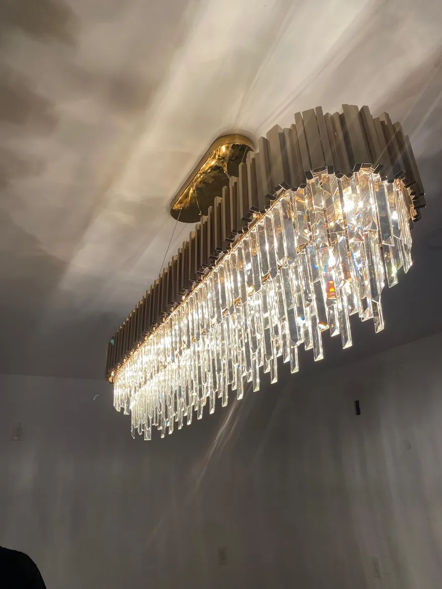 Crystal linear chandelier installed and lit