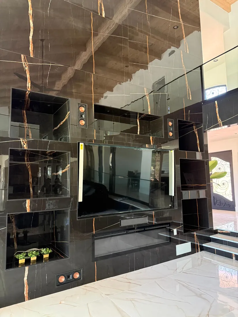 Media wall with in wall speakers, installed by ElitePhase Electric
