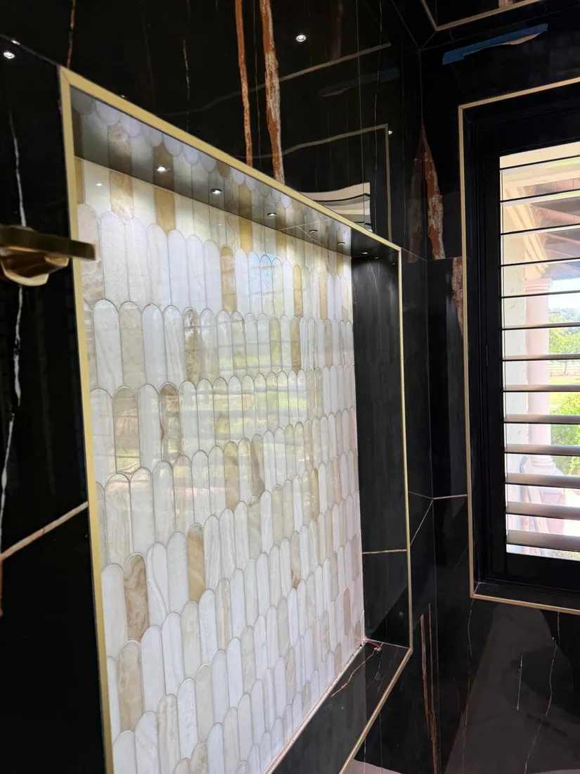 Low voltage accent lights in a shower niche, installed by ElitePhase Electric