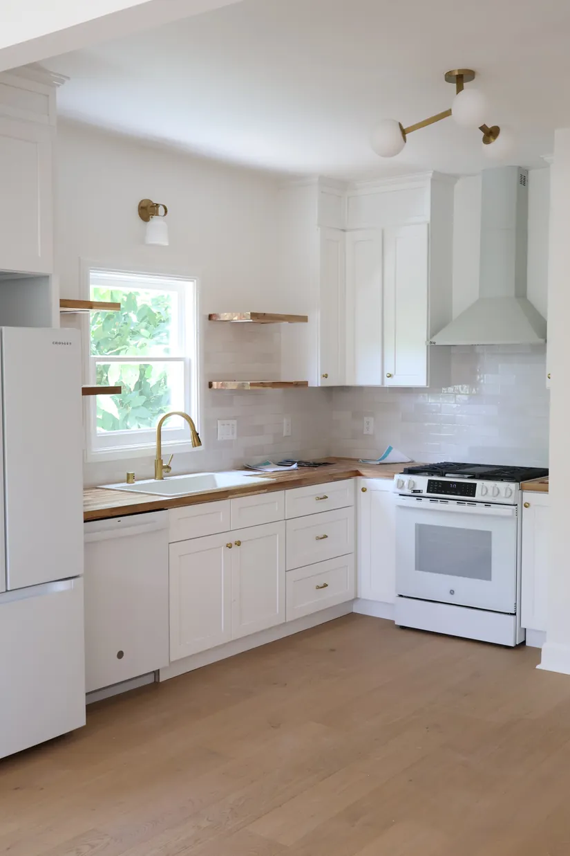 Kitchen sconces and a sink light, installed by ElitePhase Electric